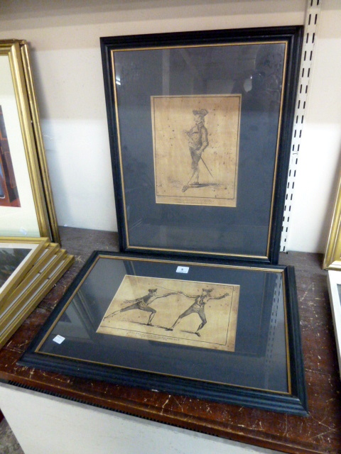 A pair of fencing prints, framed