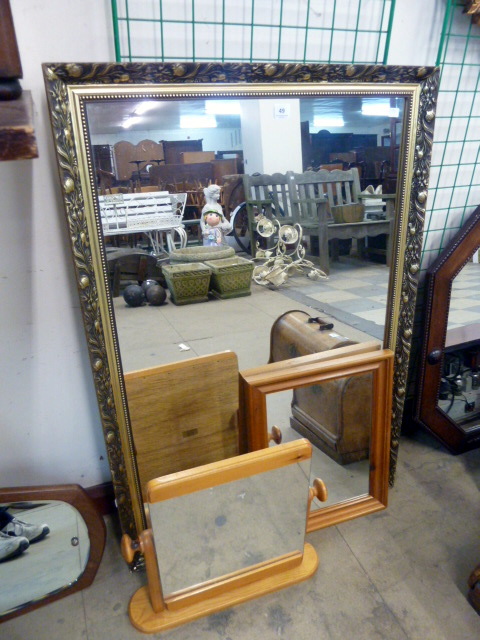 A gilt framed mirror and two pine framed mirrors