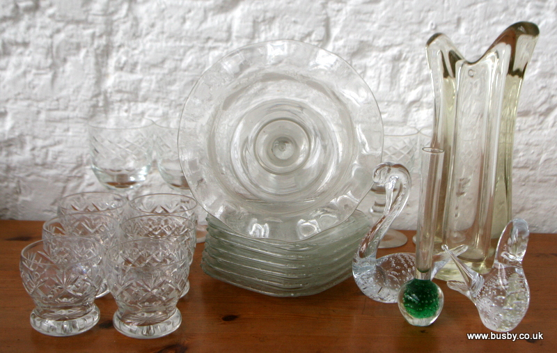 A group of lead crystal drinking glasses, studio glass, and an etched glass 19th century bon-bon