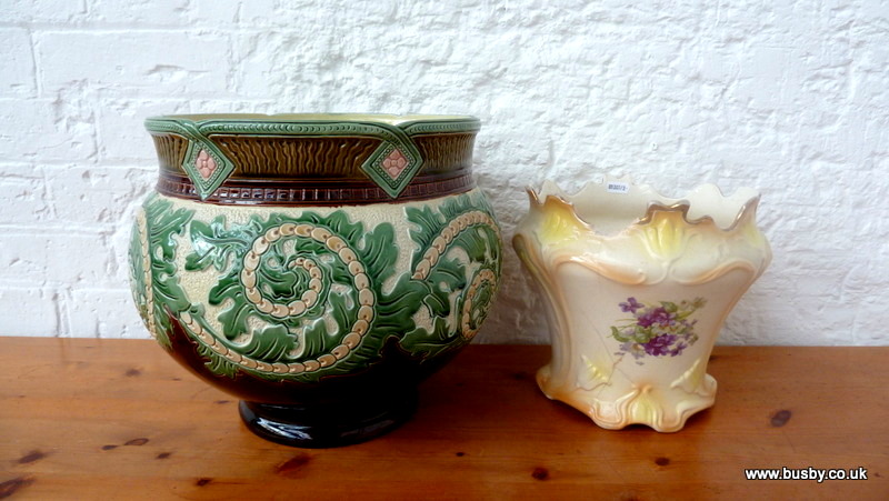 A large Edwardian majolica replica jardiniere with scrolling acanthus decoration in browns and