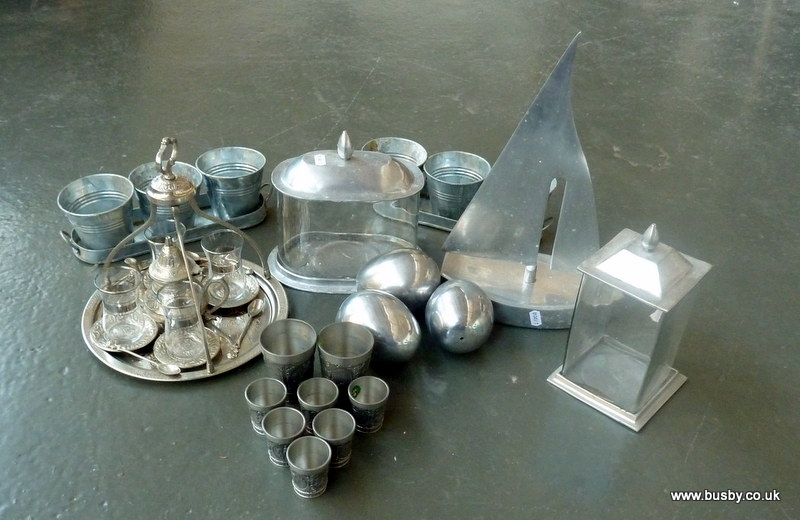 Collection of alloy wares to include a yacht, three eggs and two lidded jars plus a metal and