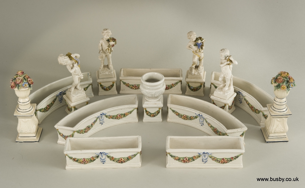 A 19th century Pearlware table centre display. A series of small curved and straight troughs with