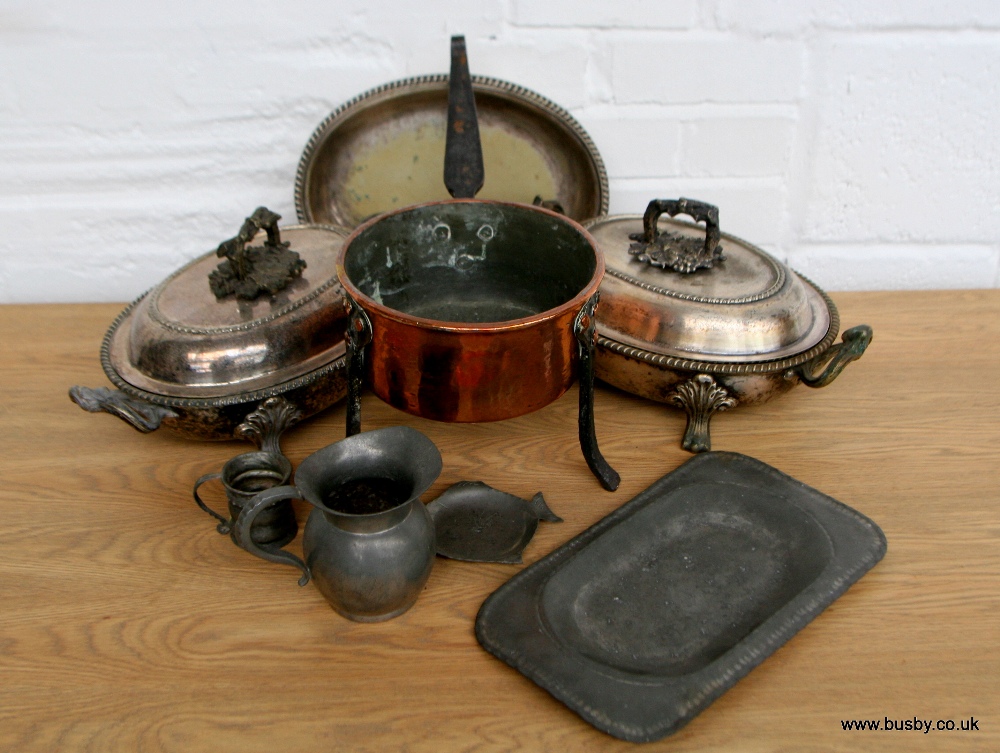 An assortment of mixed metal including an 18th Century copper trivet pan, chafing and serving dishes