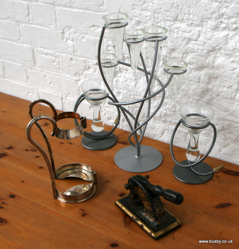 A garniture of wrought iron and glass tea light epergnes, together with a silver plated wine