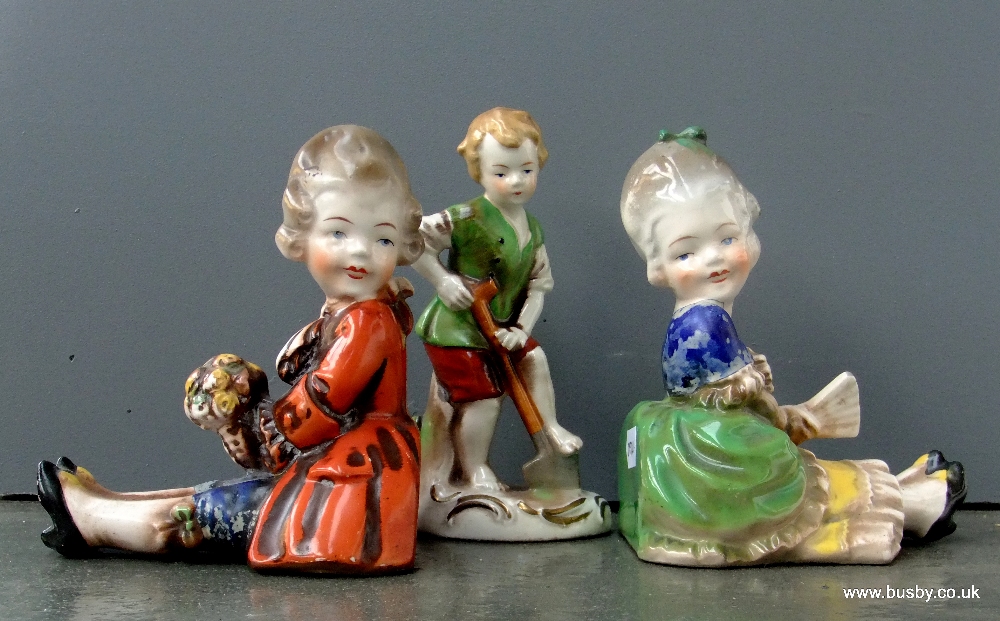 A Pair of early Goebel & M I Hummel figural bookends, plus similar early figure group, marks for the