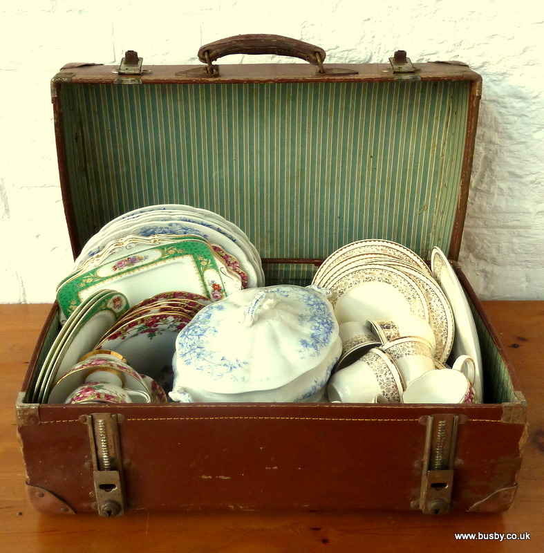 A suitcase of assorted pottery and porcelain.