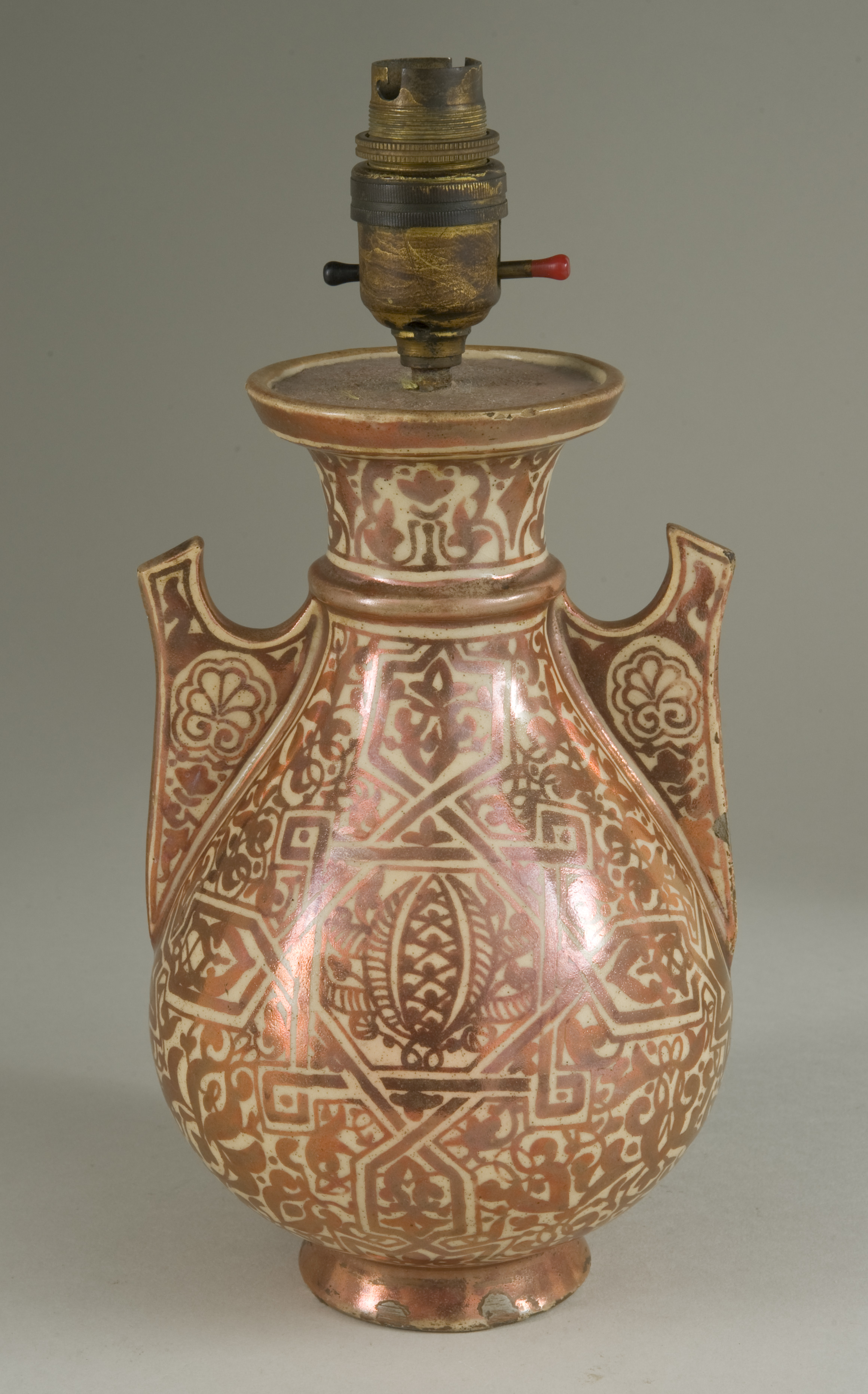 A 19th century Hispano-Moresque Alhambra lustre vase with boldly painted geometric design amidst