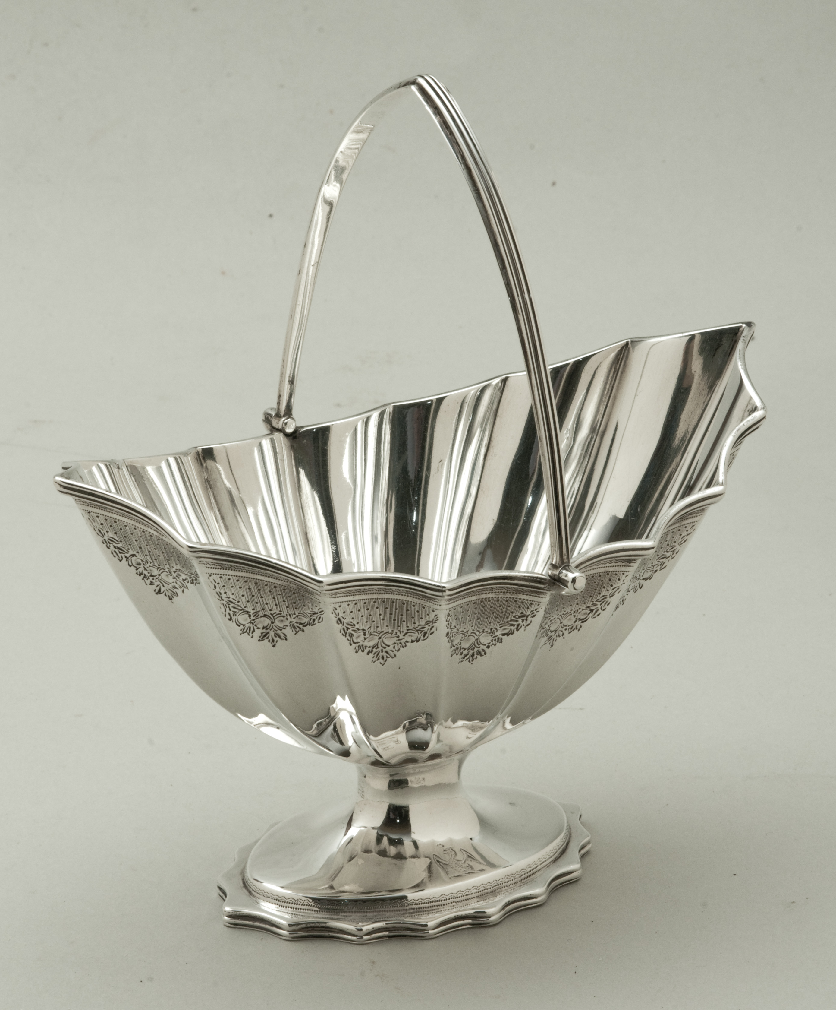 A George III silver hallmarked swing handle sugar basket, London 1790 by Charles Aldridge of oval