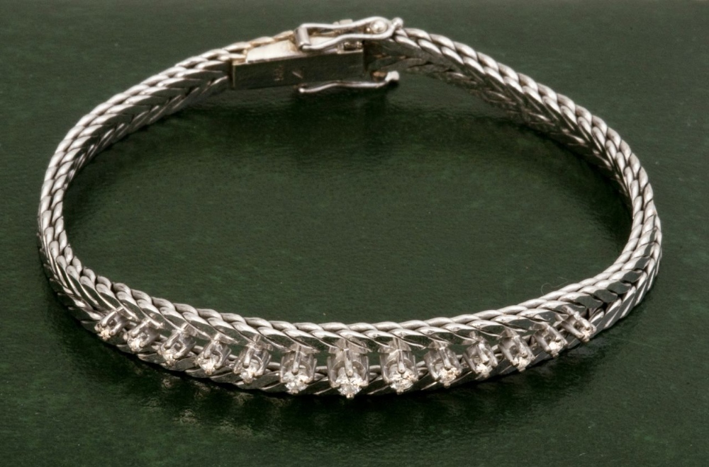 A 1960s vintage 14ct white gold feather link 13 stone diamond bracelet (diamonds graduated 2mm and