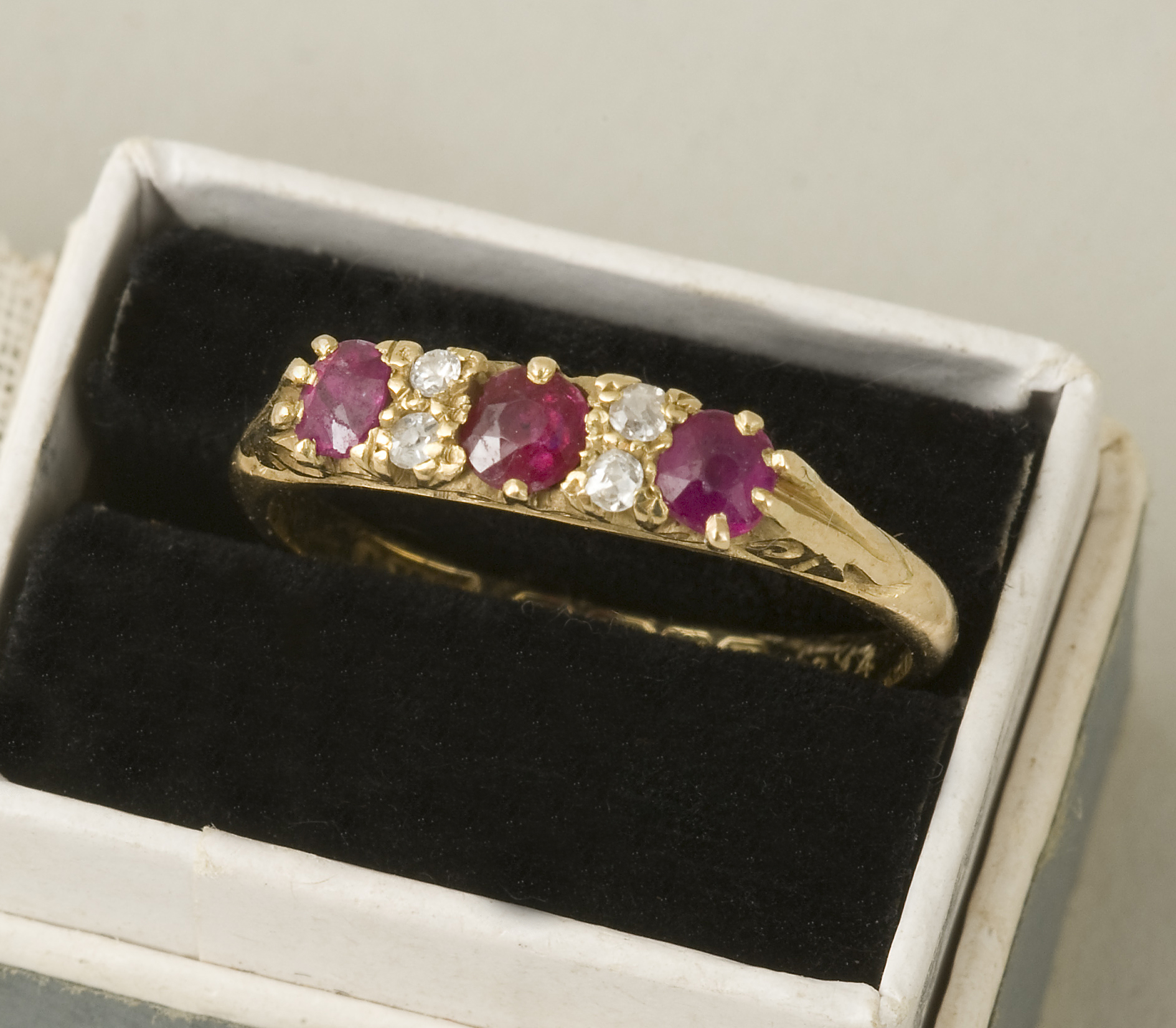 A Victorian 18ct gold lady’s diamond and ruby dress ring, Birmingham 1863, set with six chip