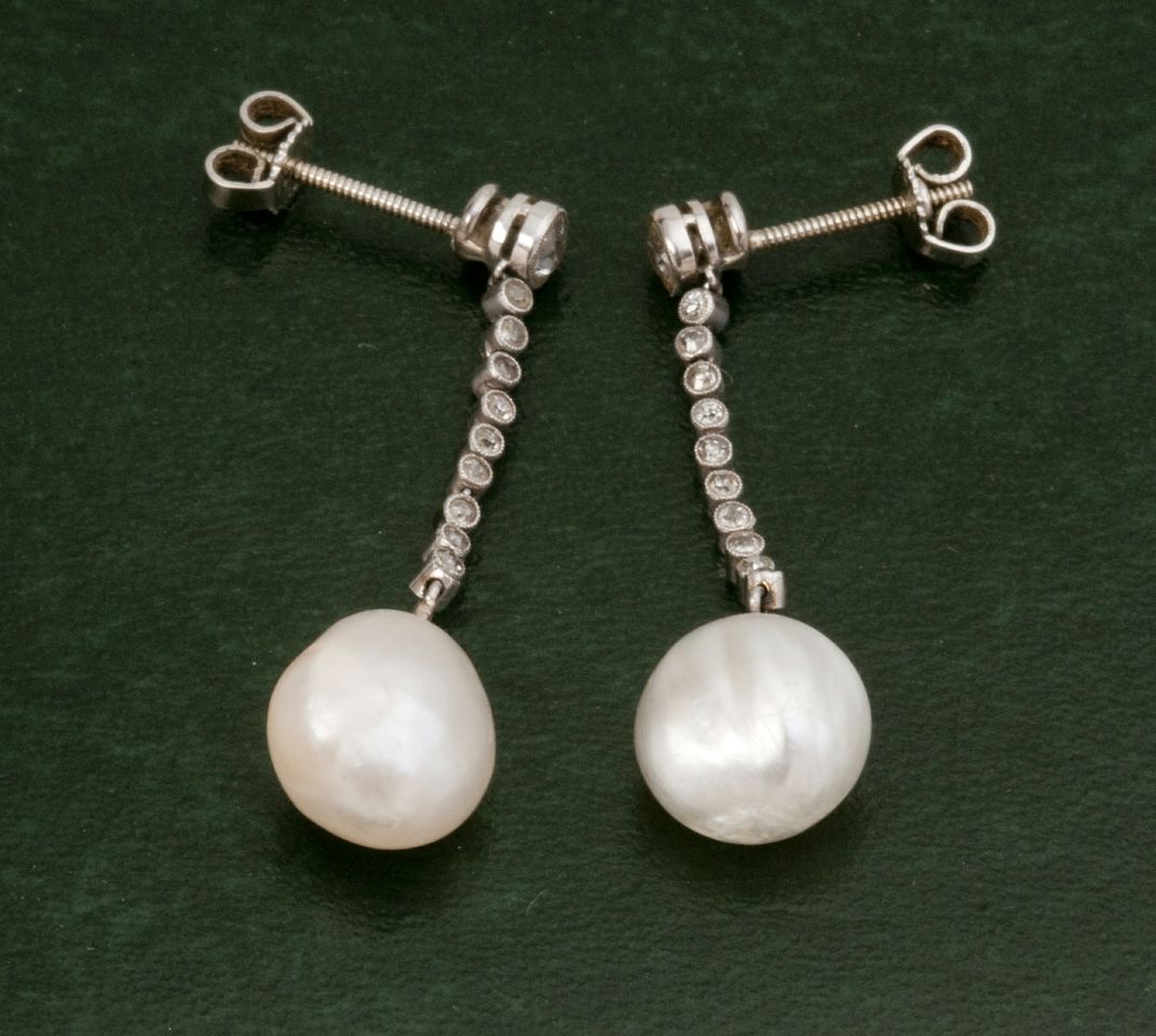 A pair of 1960s vintage 18ct white gold baroque pearl and diamond drop earrings, the teardrop shaped
