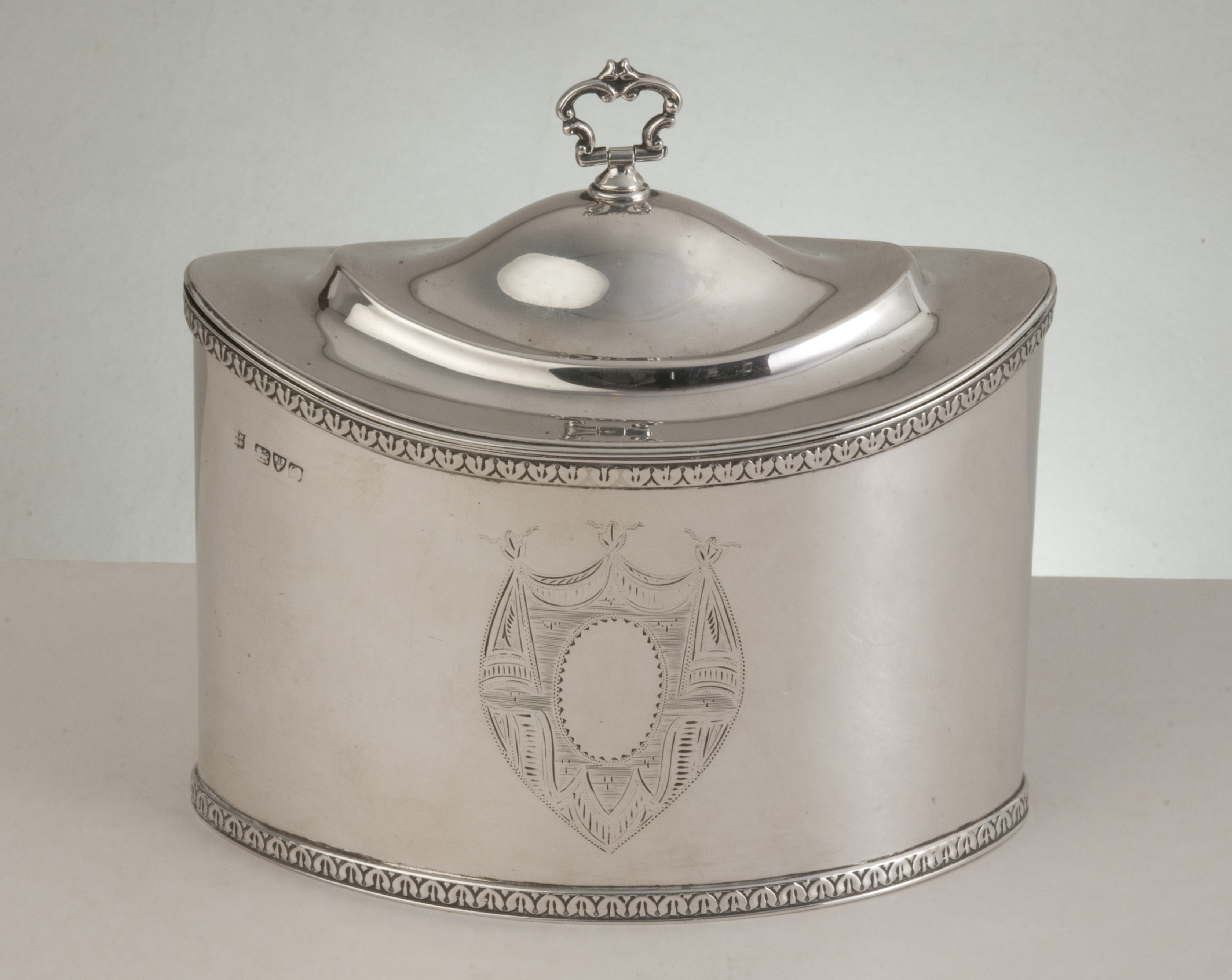 An Edwardian hallmarked silver oval tea caddy, Chester 1907 by George Nathan & Ridley Hayes in the