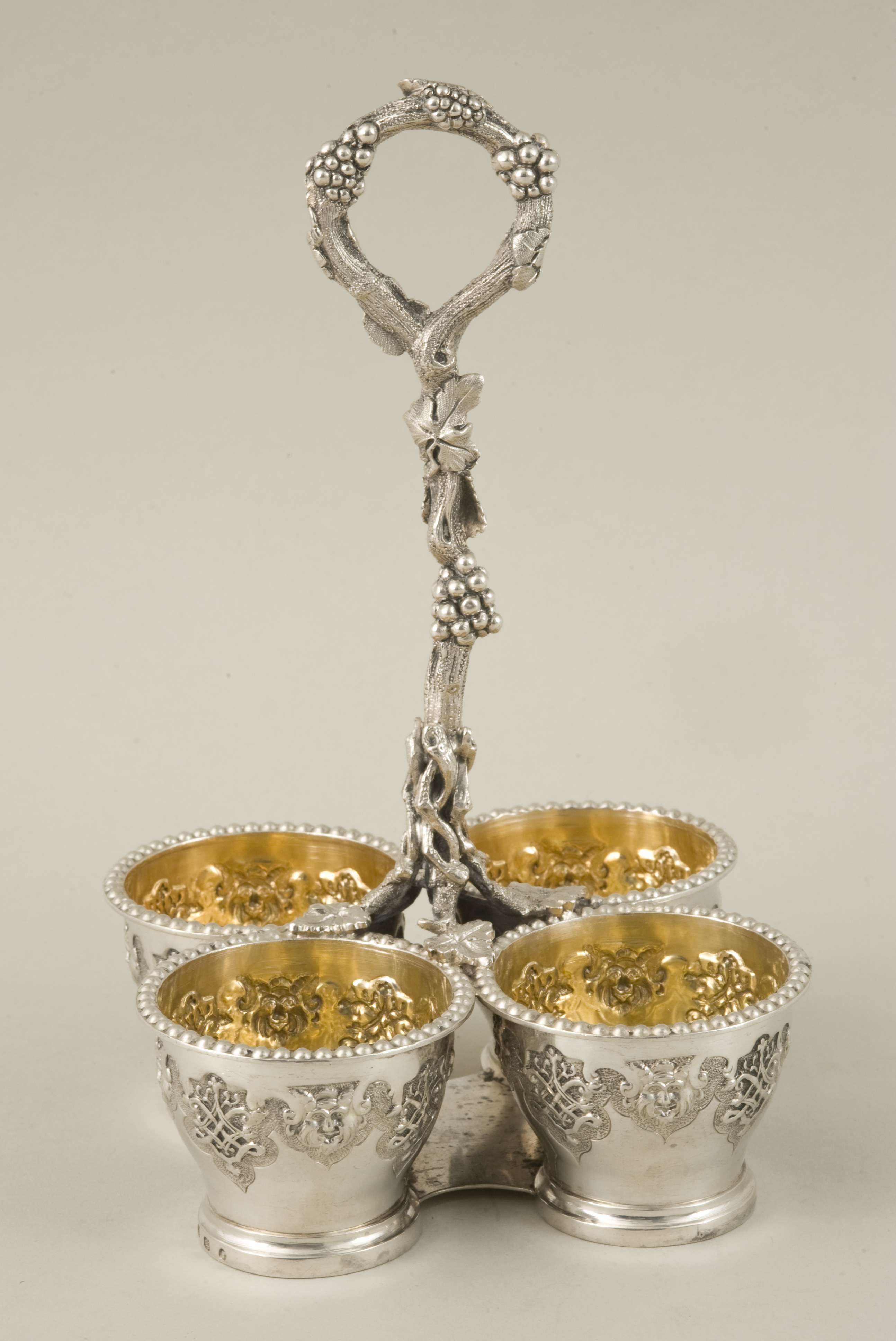 A Victorian renaissance revival hallmarked silver cruet stand, Sheffield 1855, with naturalistic