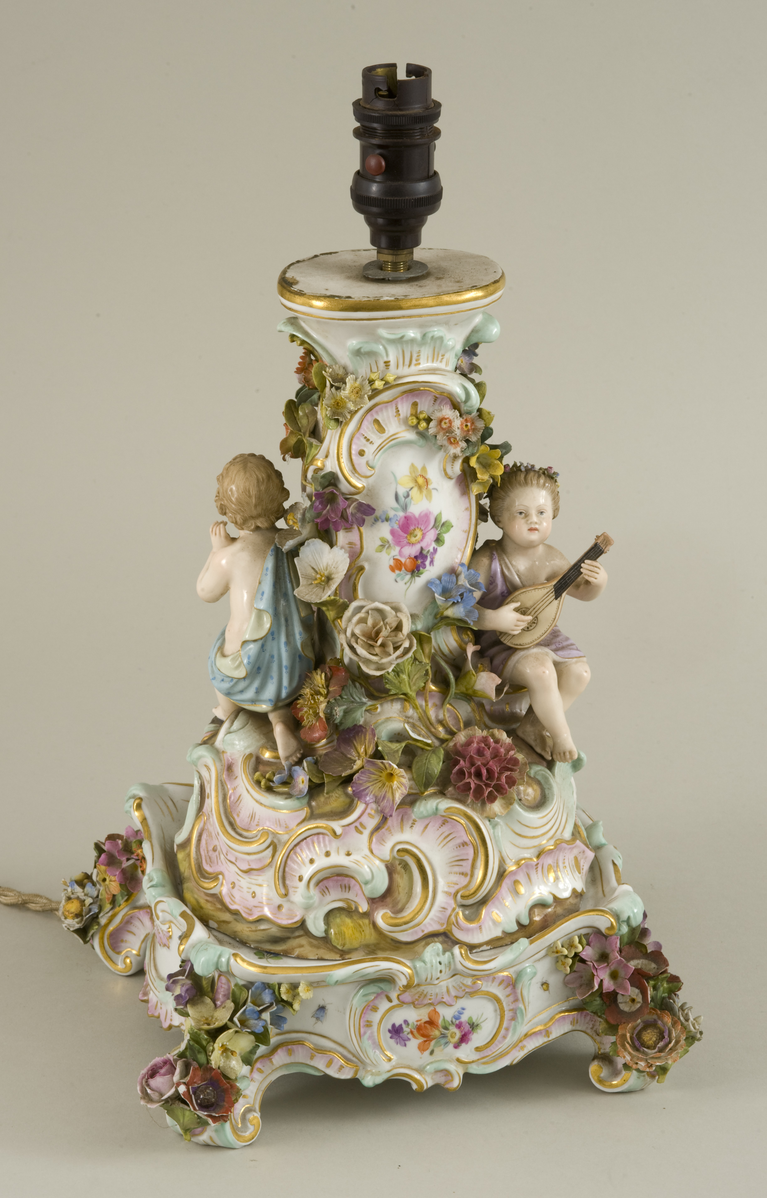 A 19th century Meissen porcelain two part centre piece, in the rococo revival style with cherubs and