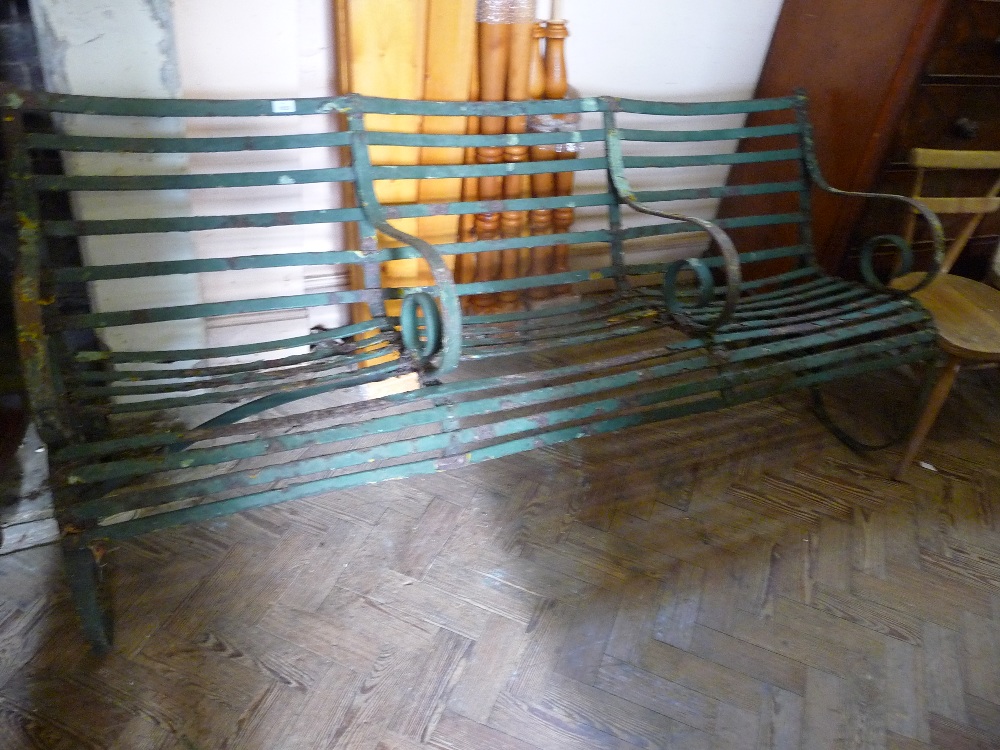 A Victorian three seat Iron garden bench D. 26 1/2" and W. 73 1/2".
