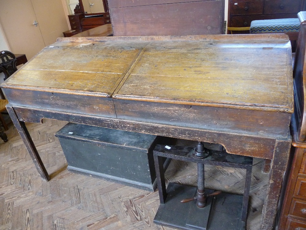 A double Pine clerk`s desk, D. 26 1/2", D. 75 1/2", H to slope 38" and rear H. 44 1/2".