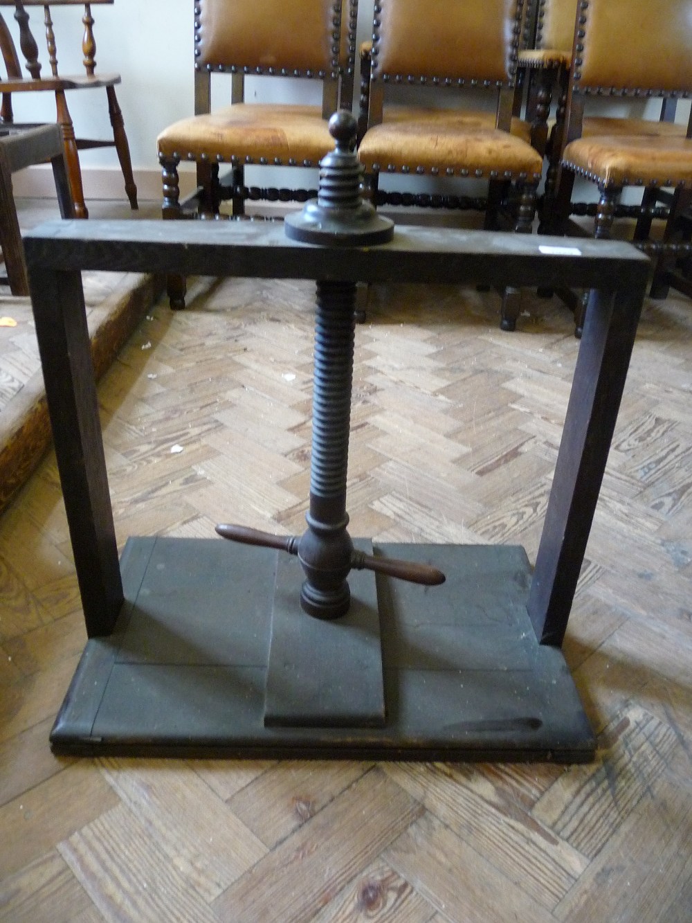 An Oak and Mahogany table top book press, D.15" x W.24" and H. 26 1/2".