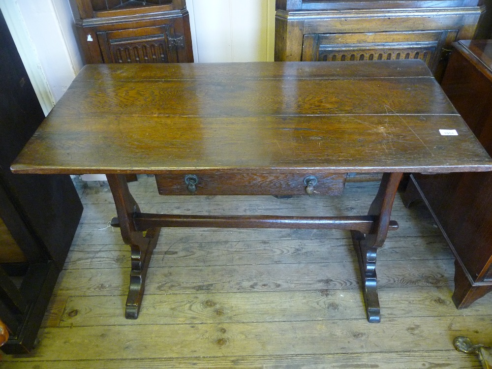 An Oak refectory style hall table with single drawer D. 21", W. 42 1/4" and H. 29".