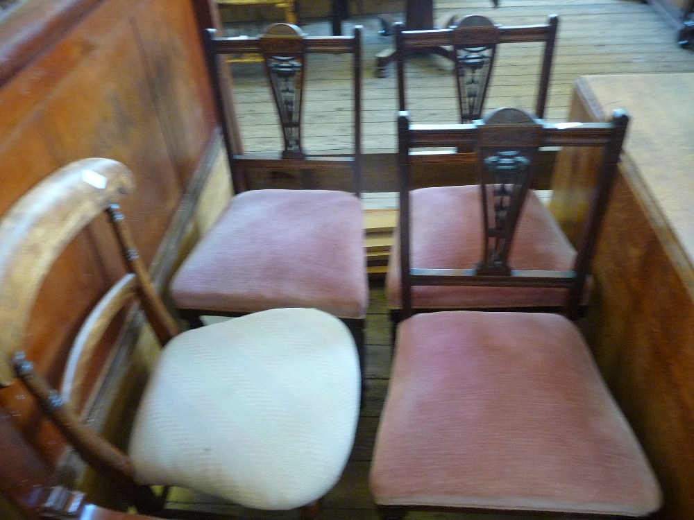 Three dark stained Oak dining room side chairs and one other.