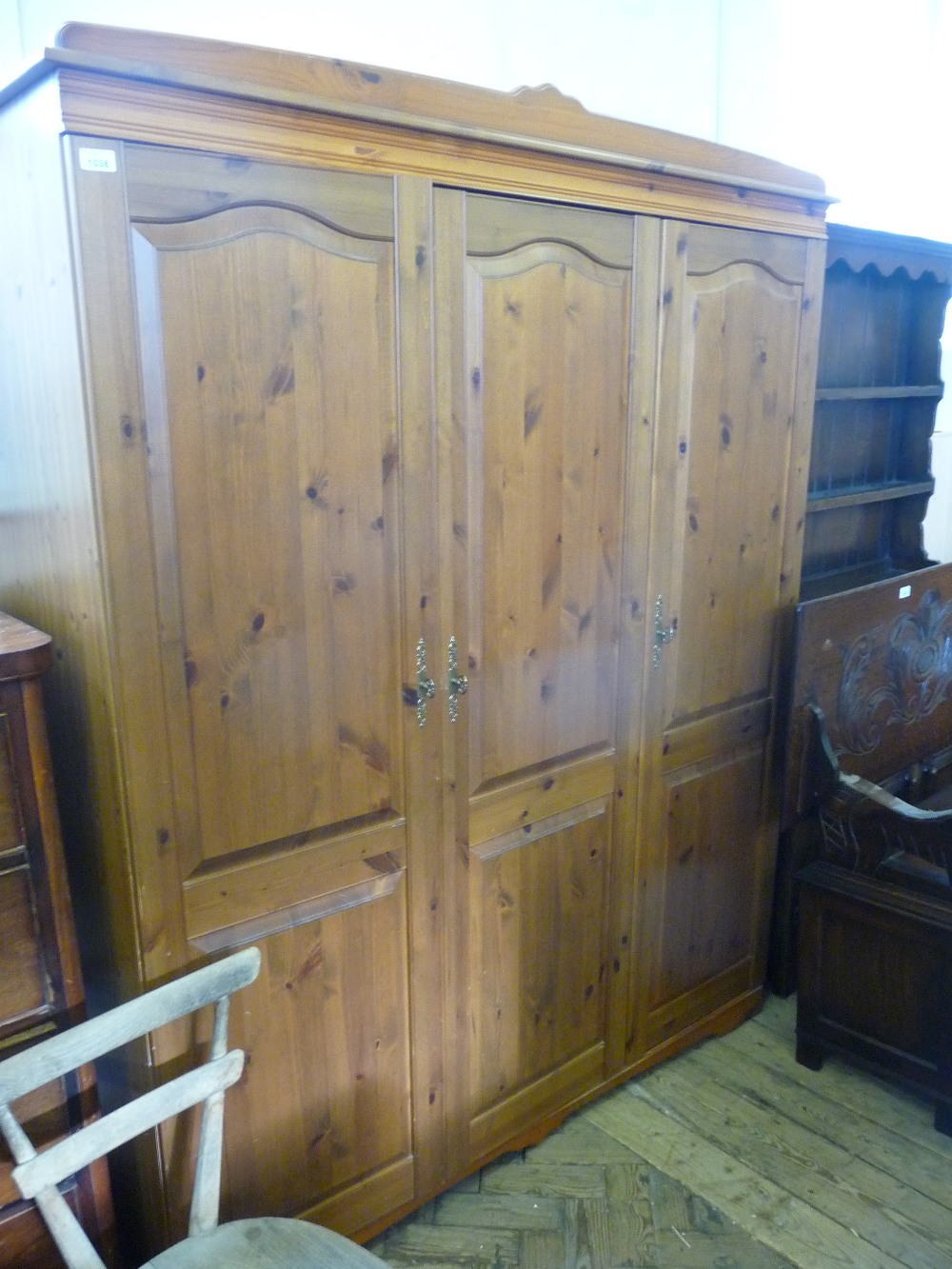 A Pine triple door wardrobe.