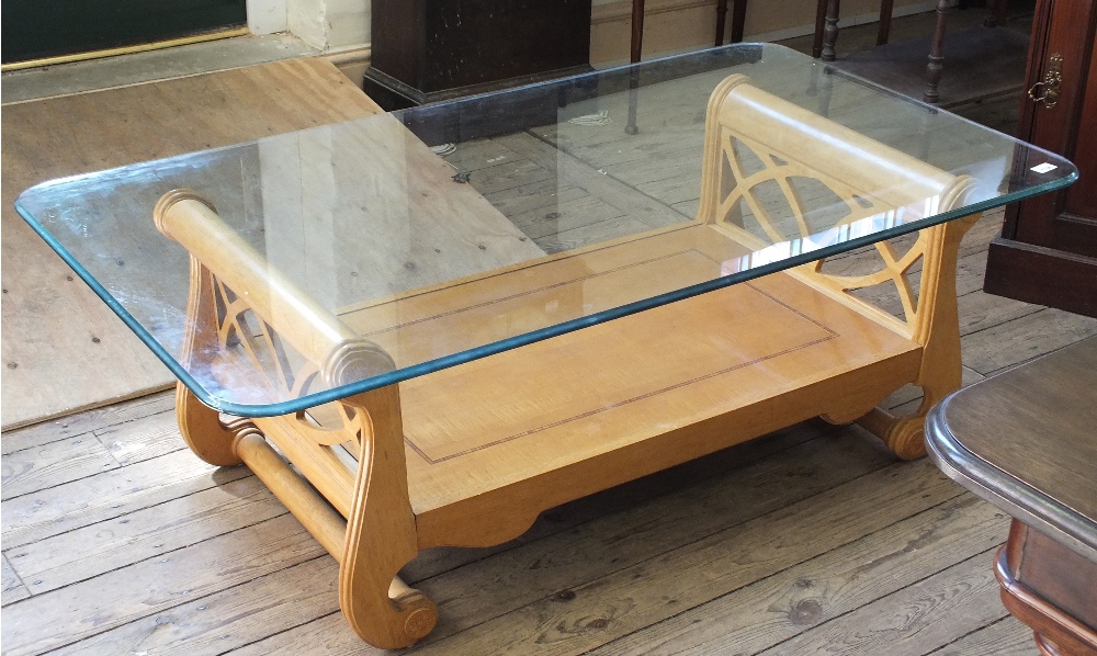 A large contemporary glass topped coffee table, D. 9 3/4 ", W. 53 1/2" and H. 18".