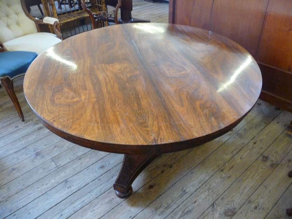 A Victorian Rosewood, circular, flap leaf pedestal dining table on tripod base, Dia. 49", H. 28"