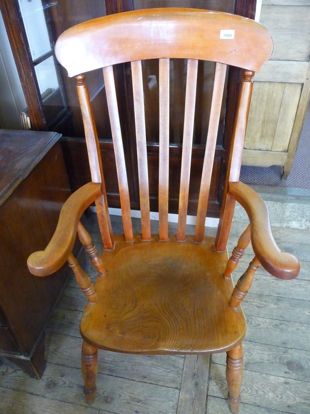 A Windsor slat back armchair.