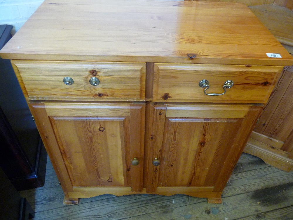 A Pine two drawer, two door cupboard.