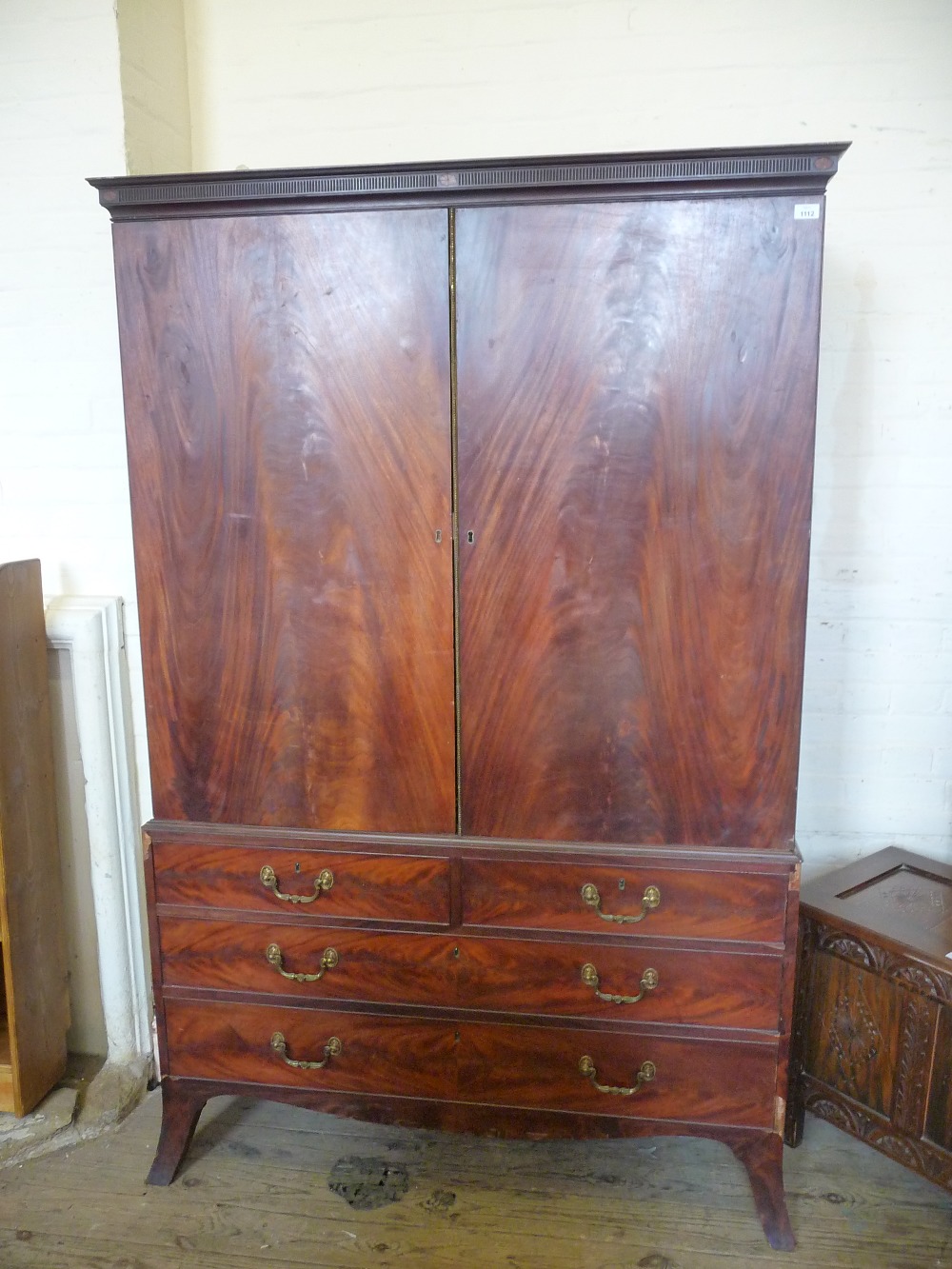 A Mahogany linen press converted to a wardrobe with two short and two long drawers, D. 24 1/2", W.