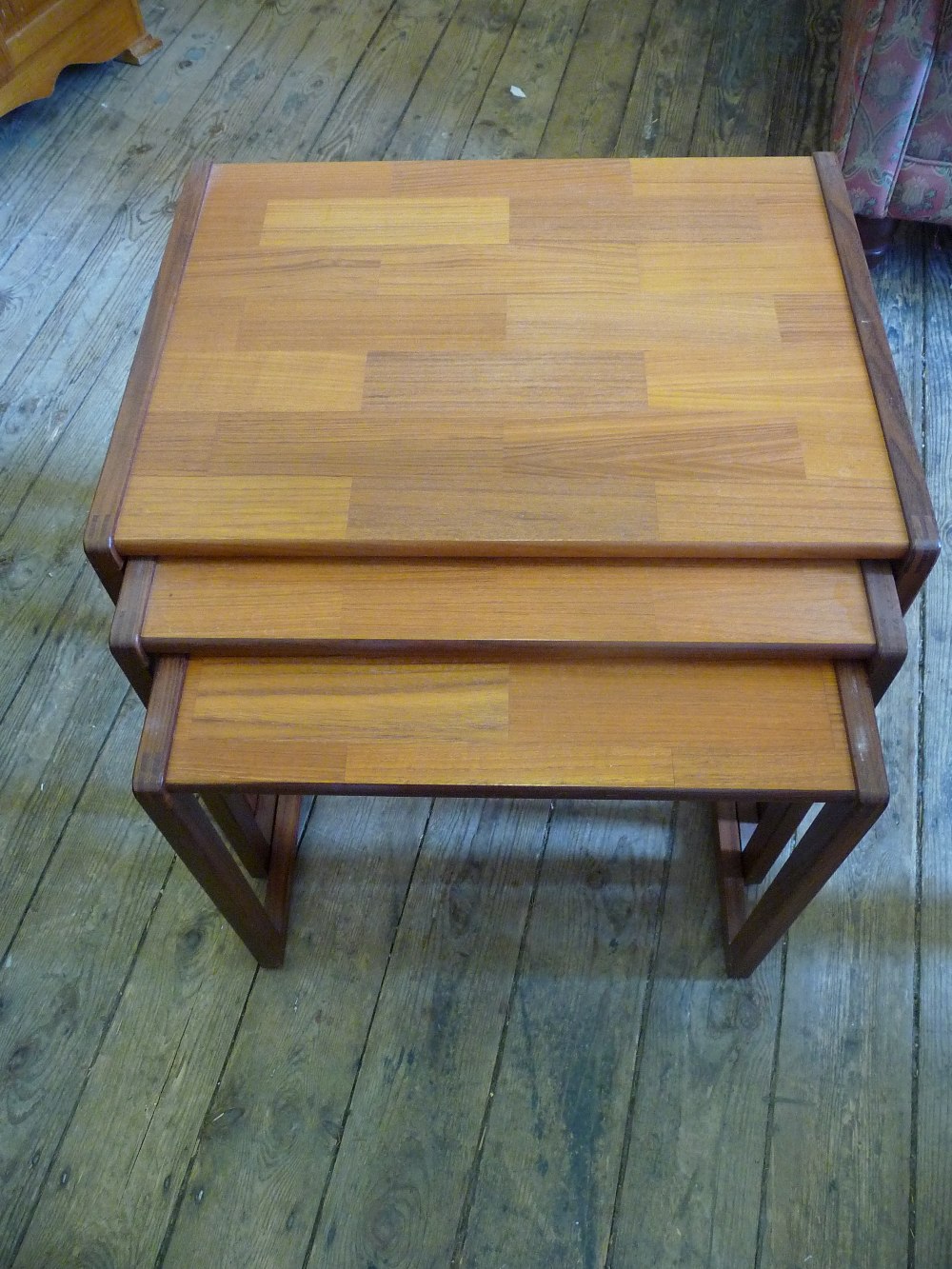 A nest of three small occasional tables.