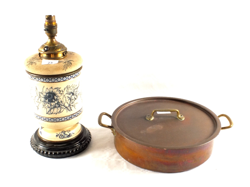 A blue floral Stoneware oil lamp, Copper pan and lid