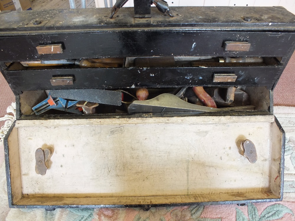 A tool box containing various carpentry tools