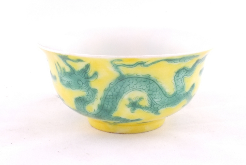 A Chinese yellow ground bowl with green dragon decoration - 6 character mark