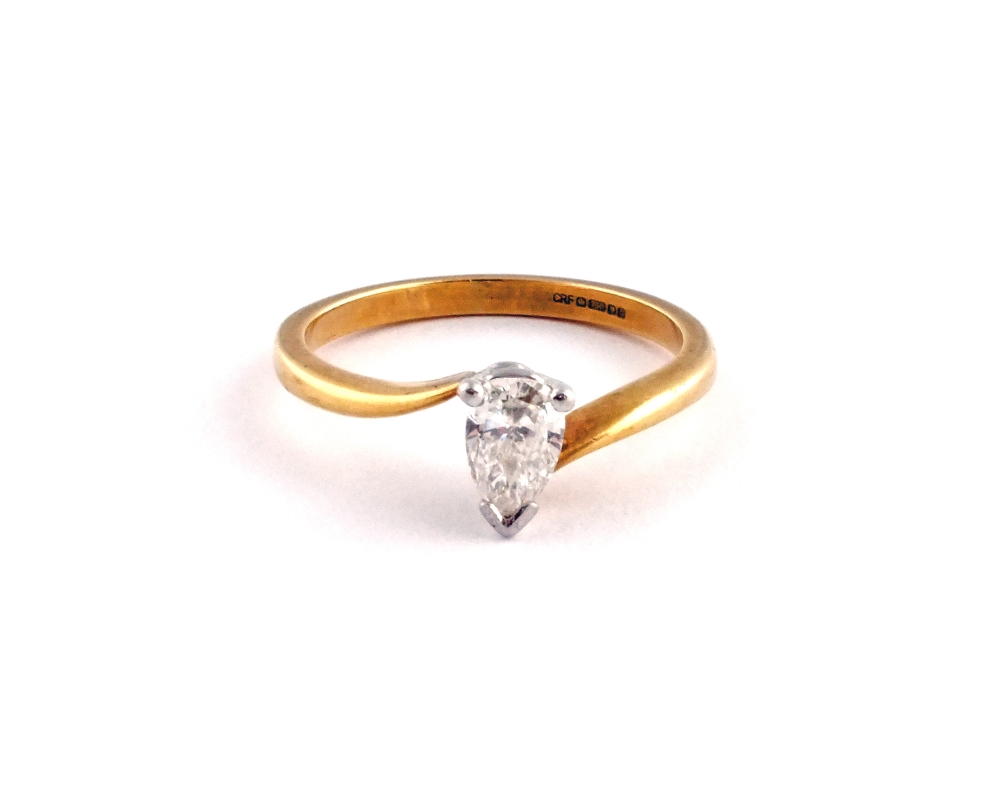 An 18ct yellow Gold pear shaped Diamond ring, size L