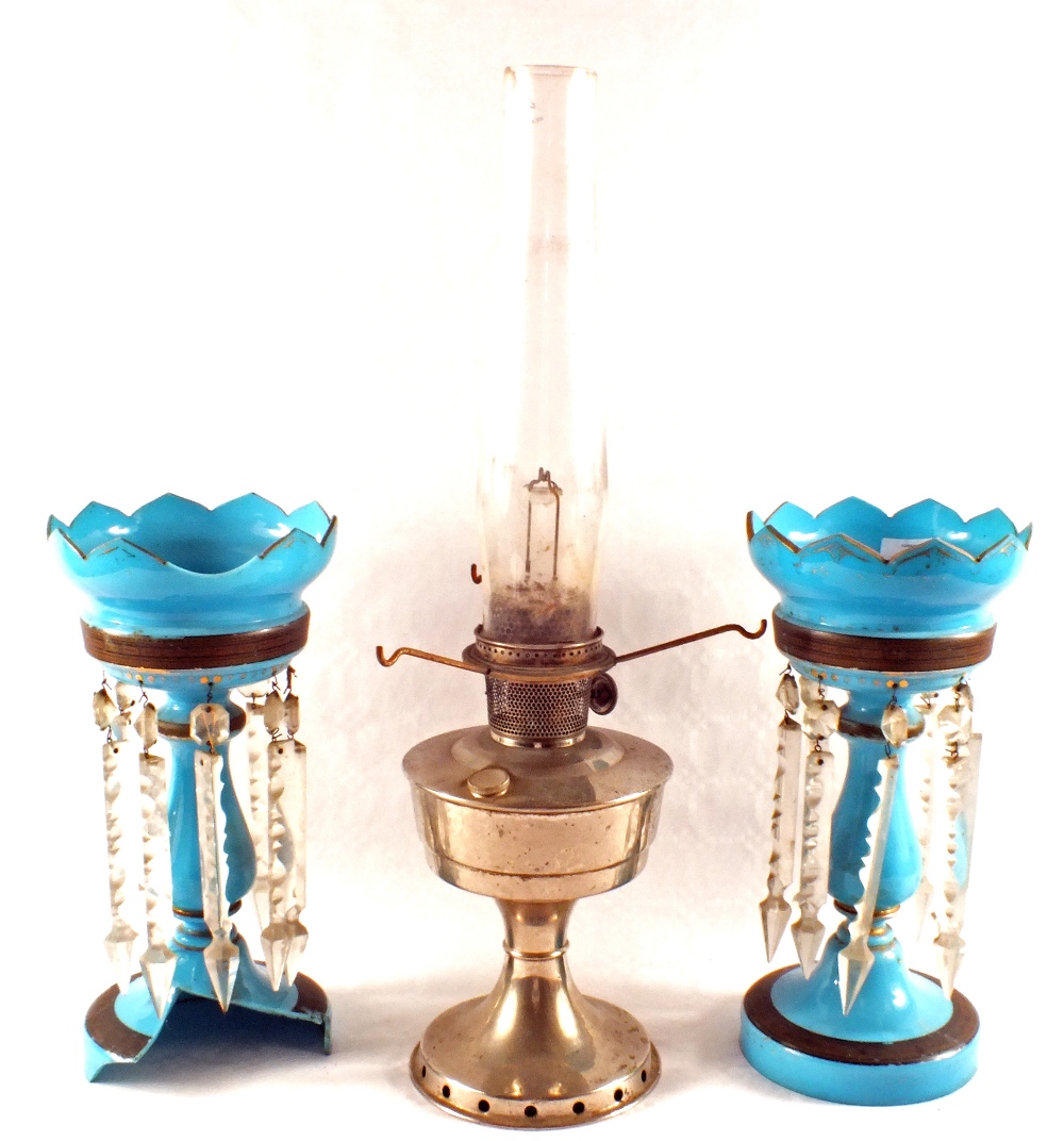 A pair of blue glass table lustres (one as found) and an Aladdin oil lamp