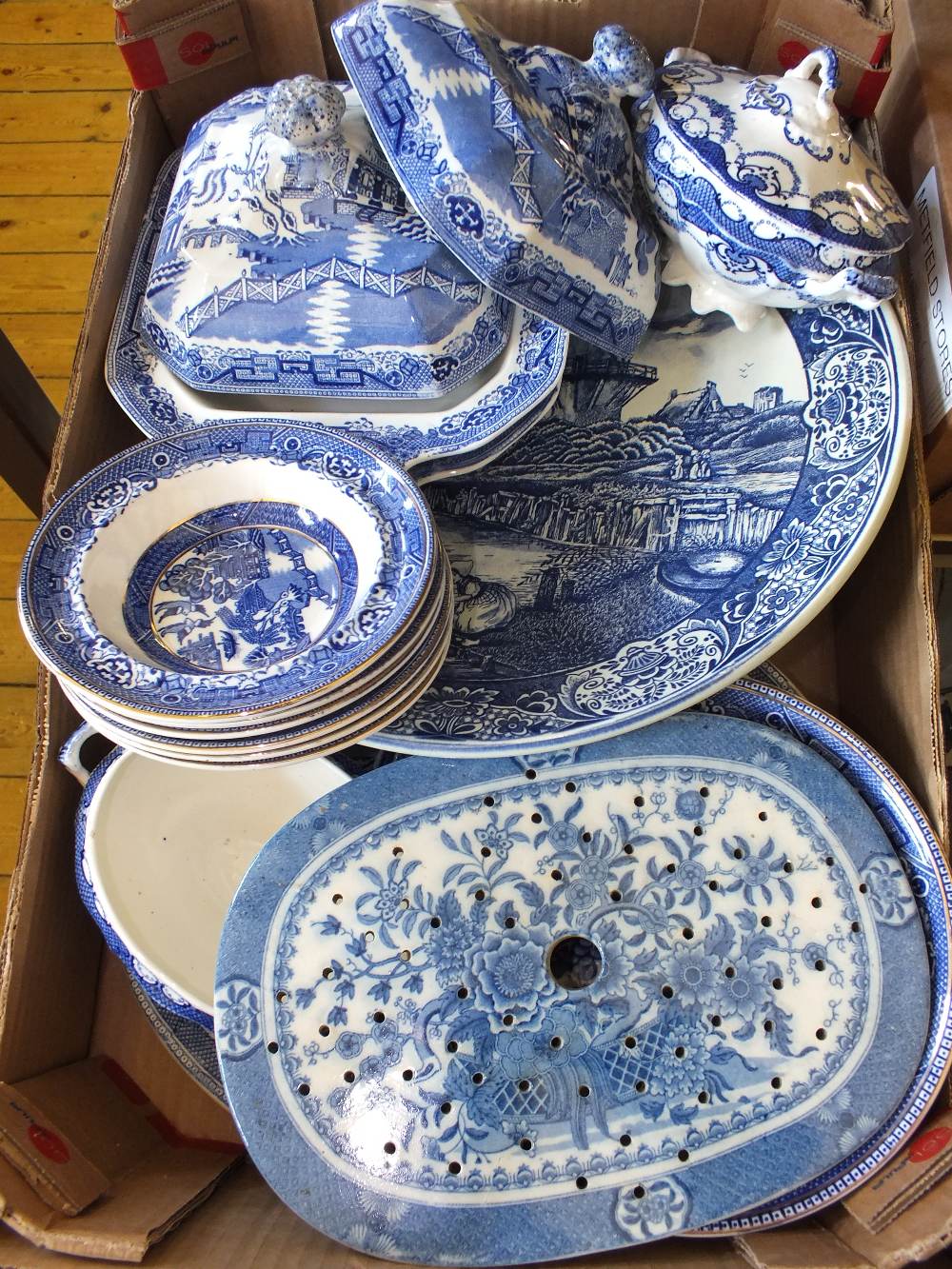 A Delft charger, various Willow pattern and other blue and white china