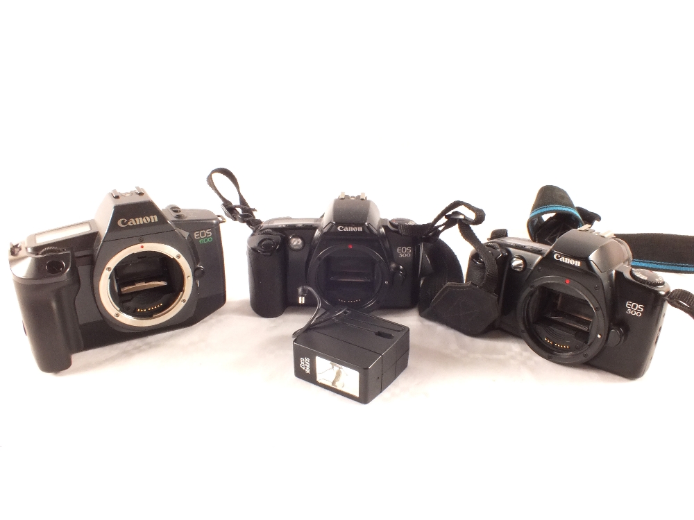 Eight various Canon cameras with guns