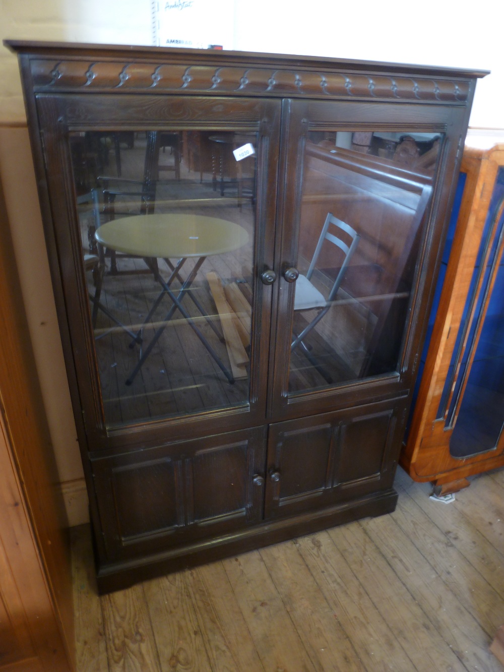 A two door Ercol glazed display cabinet