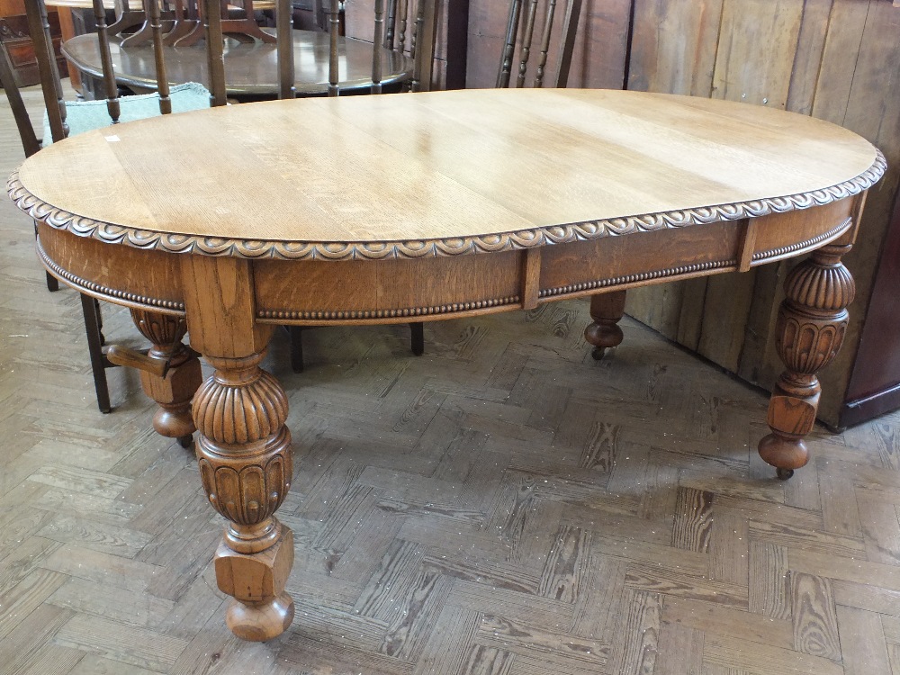 A Victorian Oak extending dining table