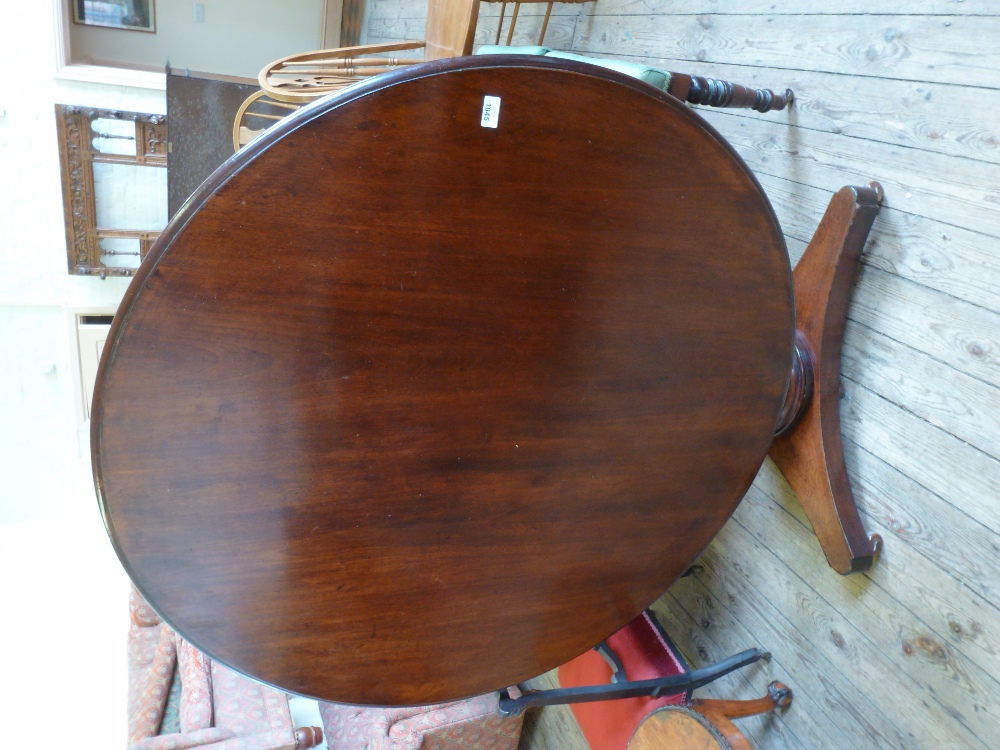 A Victorian Mahogany tilt top table