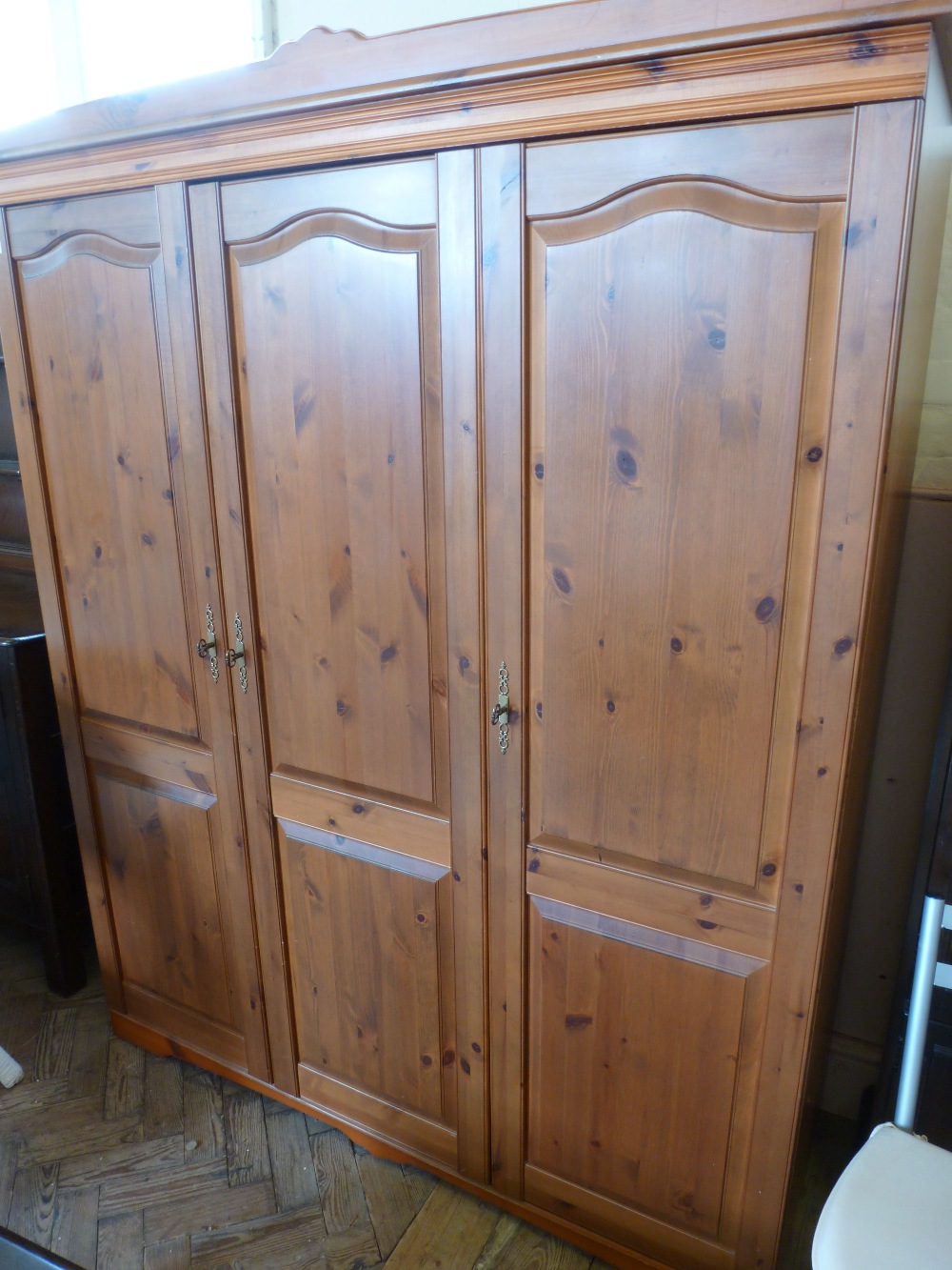 A three door Pine wardrobe