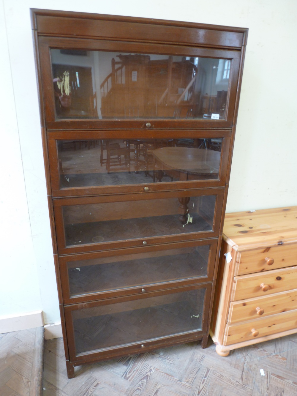 A four piece sectional glazed book case