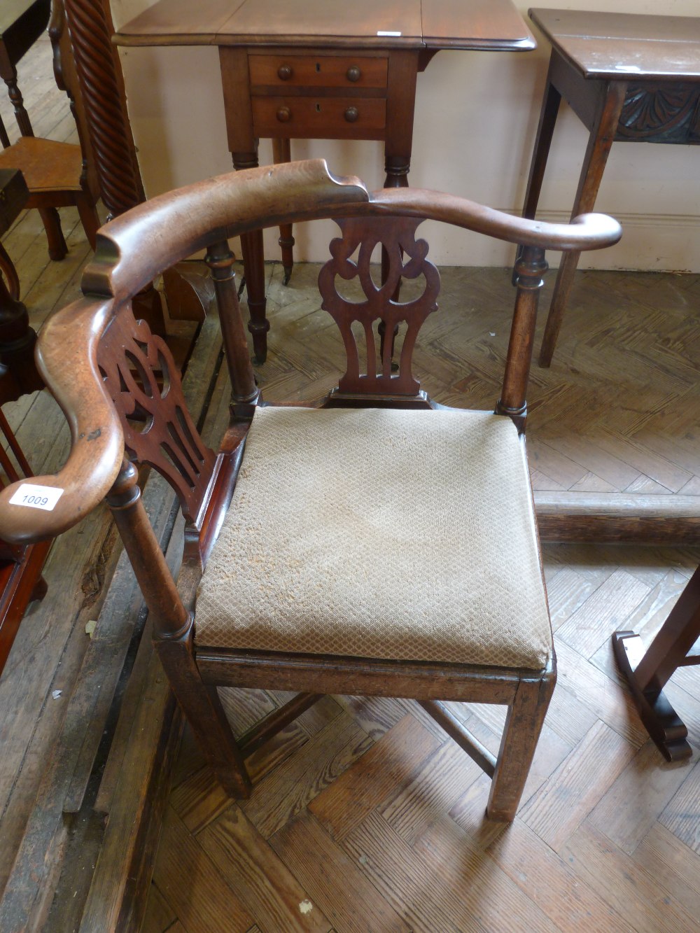 A George III Mahogany corner chair