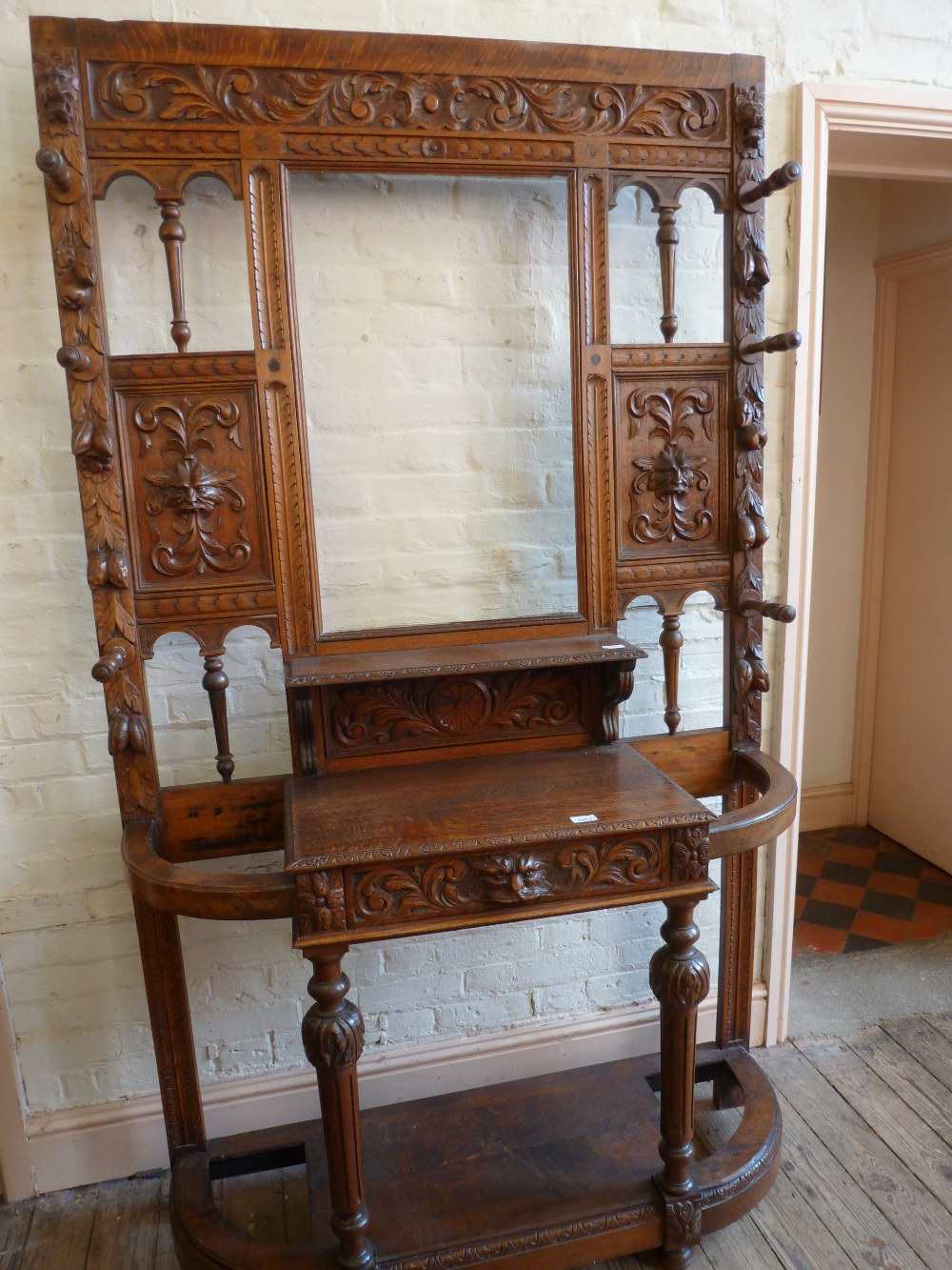 A heavily carved Oak hall stand