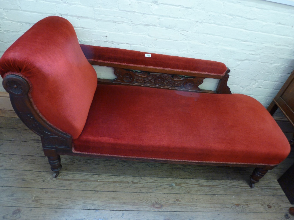 A Victorian carved Mahogany chaise longue