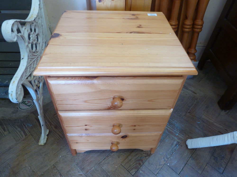 A small three drawer Pine bedside chest