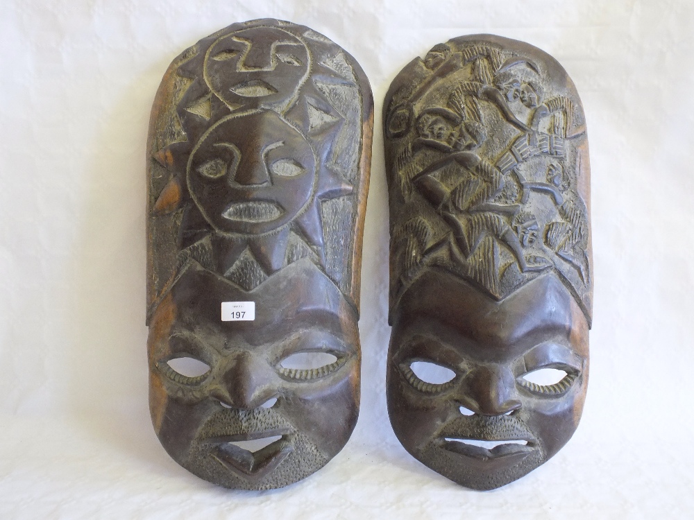 A pair of African carved wood masks