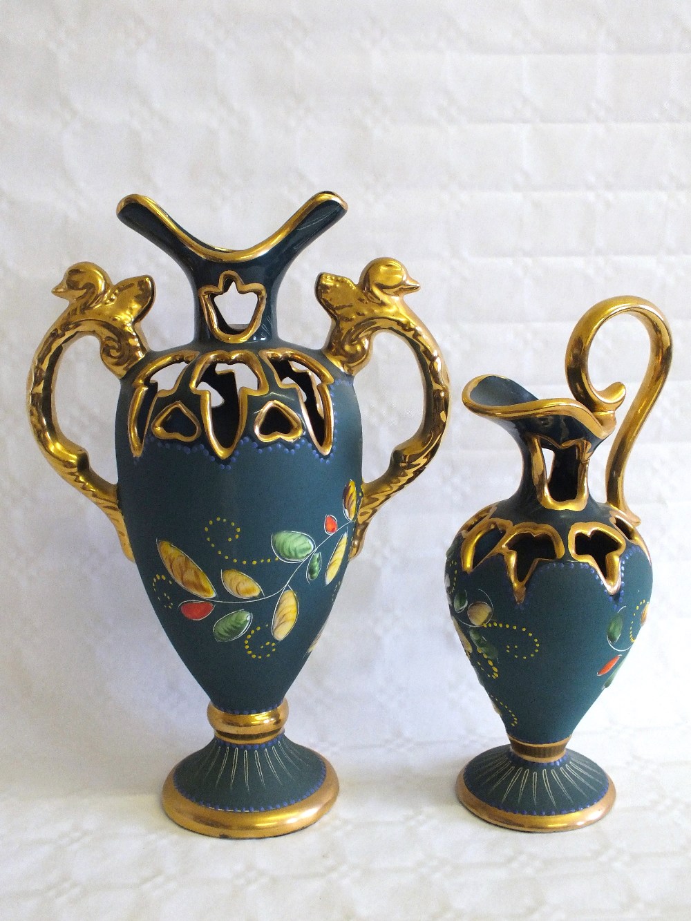 A pair of Belgian gilt and blue bird decorated vases