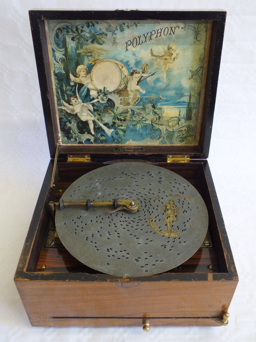 A Walnut cased Polyphon with twenty five discs