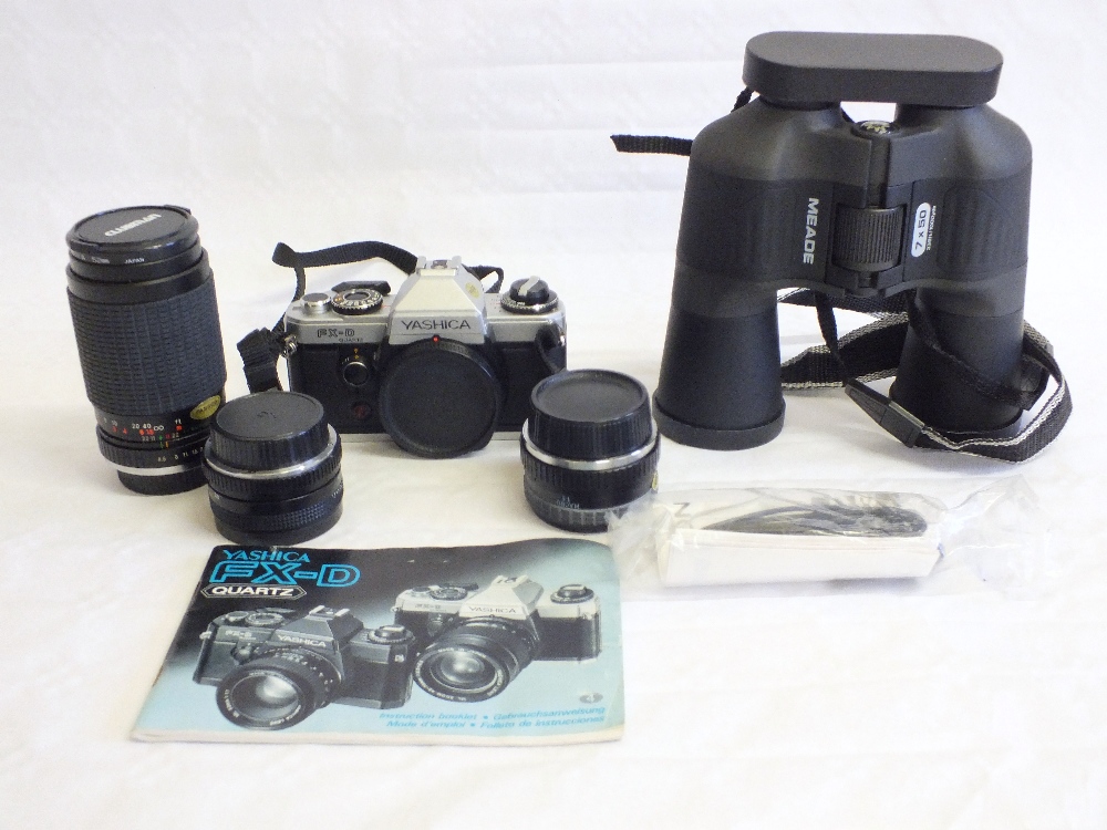 A Yashica FX-D Quartz camera, lenses and Meade 7 x 50 binoculars